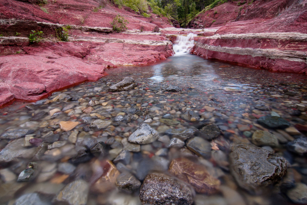 Red Rock Canyon is in Waterton Lakes National Park. During the day the creek is full of tourists wading in the shallow waters so I went back at dusk to take this photo of the unique red rock.