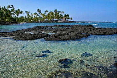 Cycling in Hawaii along cristal clear water